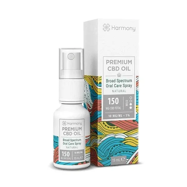 Spray Harmony CBD Natural junto a su caja blanca con ondas multicolores; la etiqueta muestra 150 mg y 15 ml.