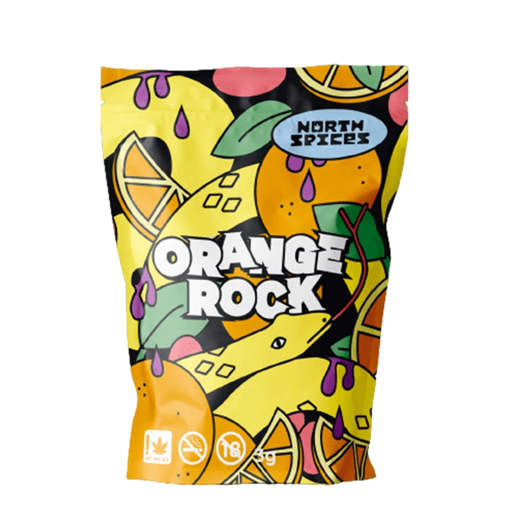 Bolsa de Orange Rock de North Spices con dibujos de naranjas, hojas verdes y gotas moradas, y la indicación de 3 g.