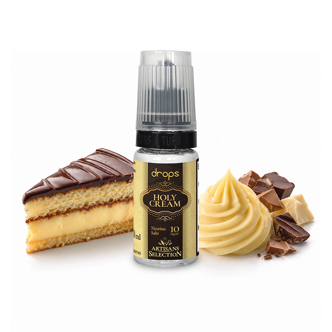 Frasco Drops Holy Cream con etiqueta negra y dorada, junto a una porción de tarta, crema y trozos de chocolate.