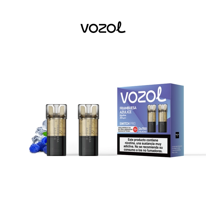 Pods Vozol Switch Pro Frambuesa Azul Ice junto a una caja violeta y azul con advertencia de nicotina, sobre fondo blanco. Pods Vozol Switch Pro Frambuesa Azul Ice junto a una caja violeta y azul con advertencia de nicotina, sobre fondo blanco.
