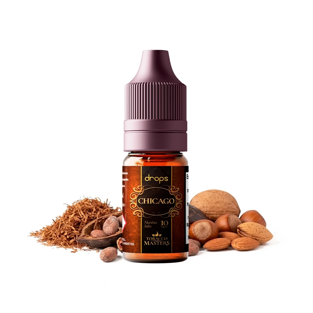 Frasco Drops Tobacco Masters Salts Chicago con tapón malva y etiqueta negra y dorada, rodeado de tabaco y frutos secos.