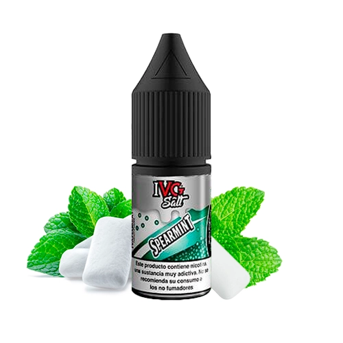 Frasco IVG Salt Spearmint con tapón negro y etiqueta verde y gris, acompañado de hojas de menta y piezas blancas sobre fondo blanco.