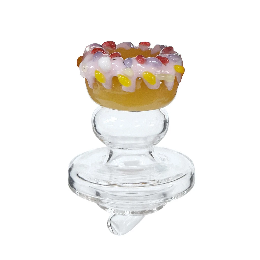 Carb Cup Cristal Donut transparente con base circular y adorno superior de dónut con glaseado rosa y detalles de colores.