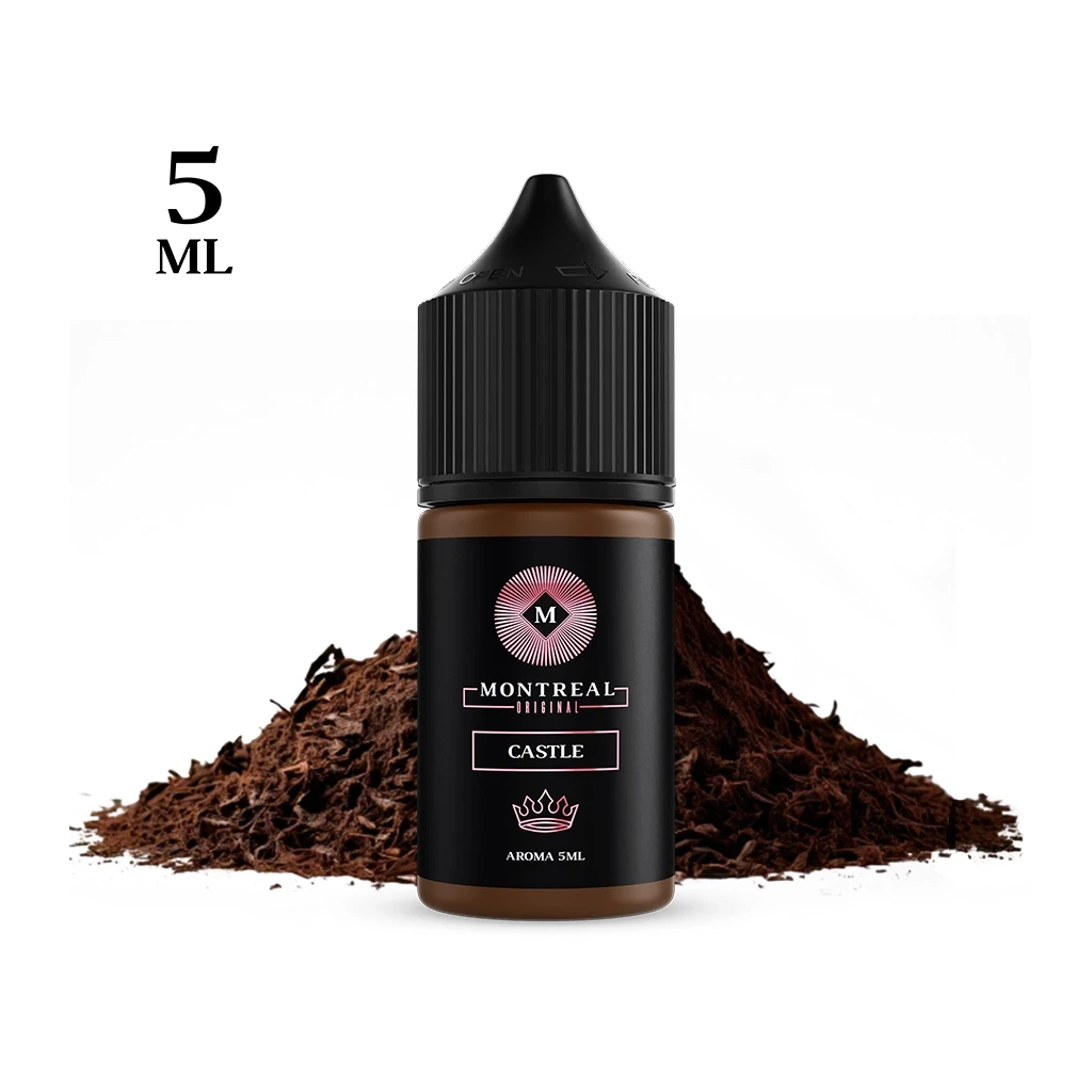 Frasco Montreal Original Castle con tapón negro y etiqueta de aroma de 5 ml, delante de un montón de hebras marrones sobre fondo blanco.