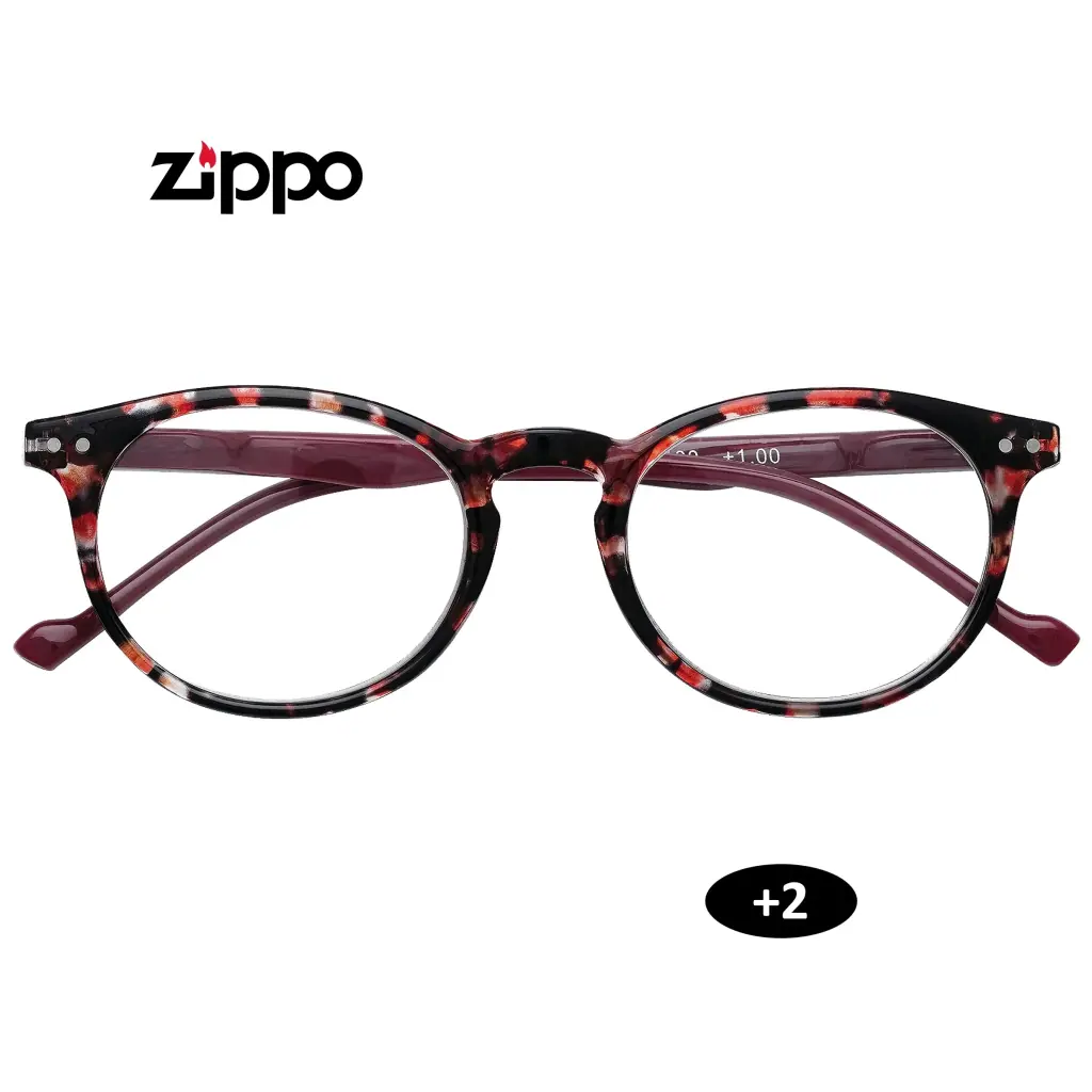Gafas Zippo de frente, con montura negra moteada en rojo y patillas burdeos; distintivo +2 y marca +1.00 visible en una lente.