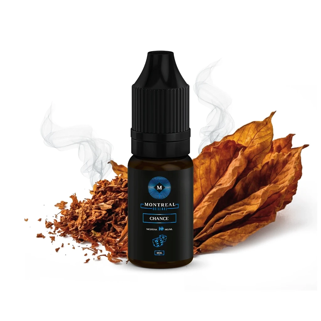 Frasco Montreal Original Chance con tapón negro y etiqueta oscura con detalles azules, delante de hojas secas y tabaco picado.