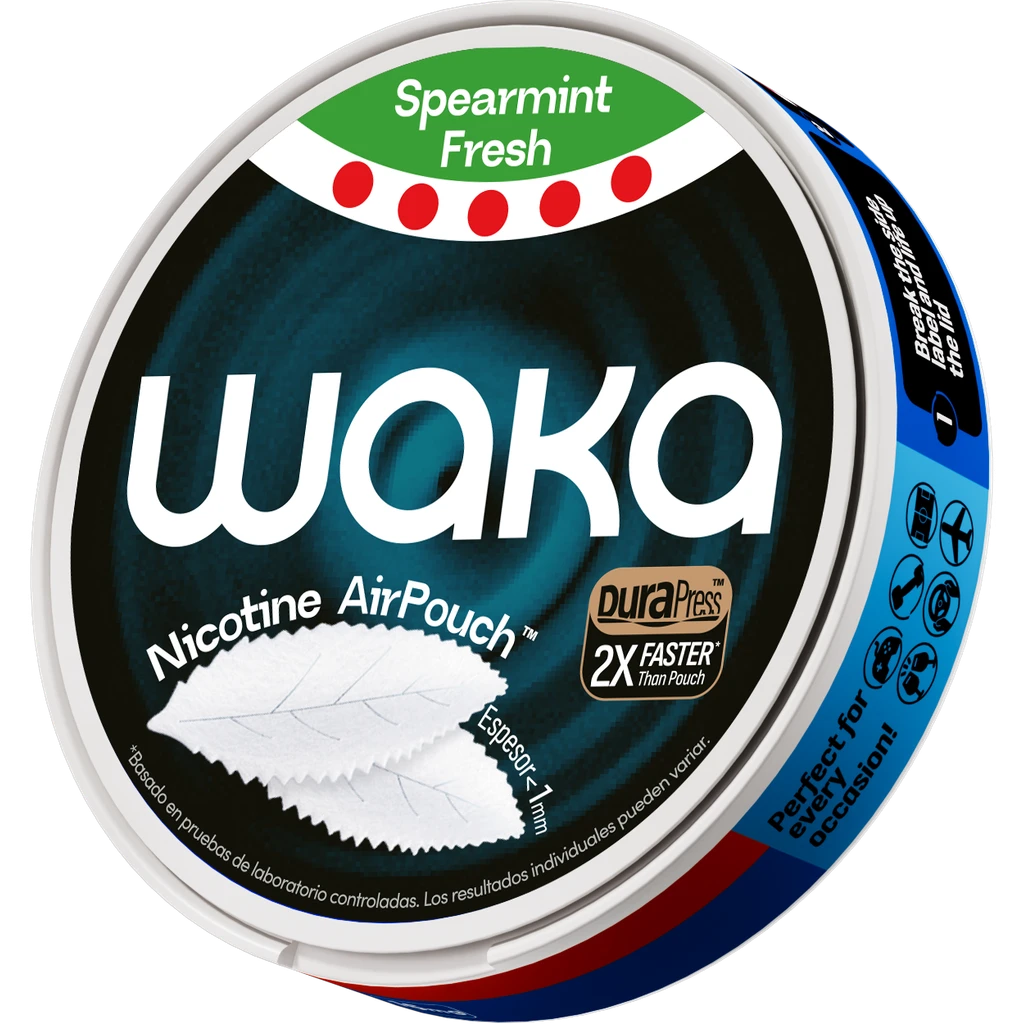 Envase redondo de Waka Spearmint Fresh, visto en perspectiva, con etiqueta oscura, franja verde y bolsas blancas ilustradas.