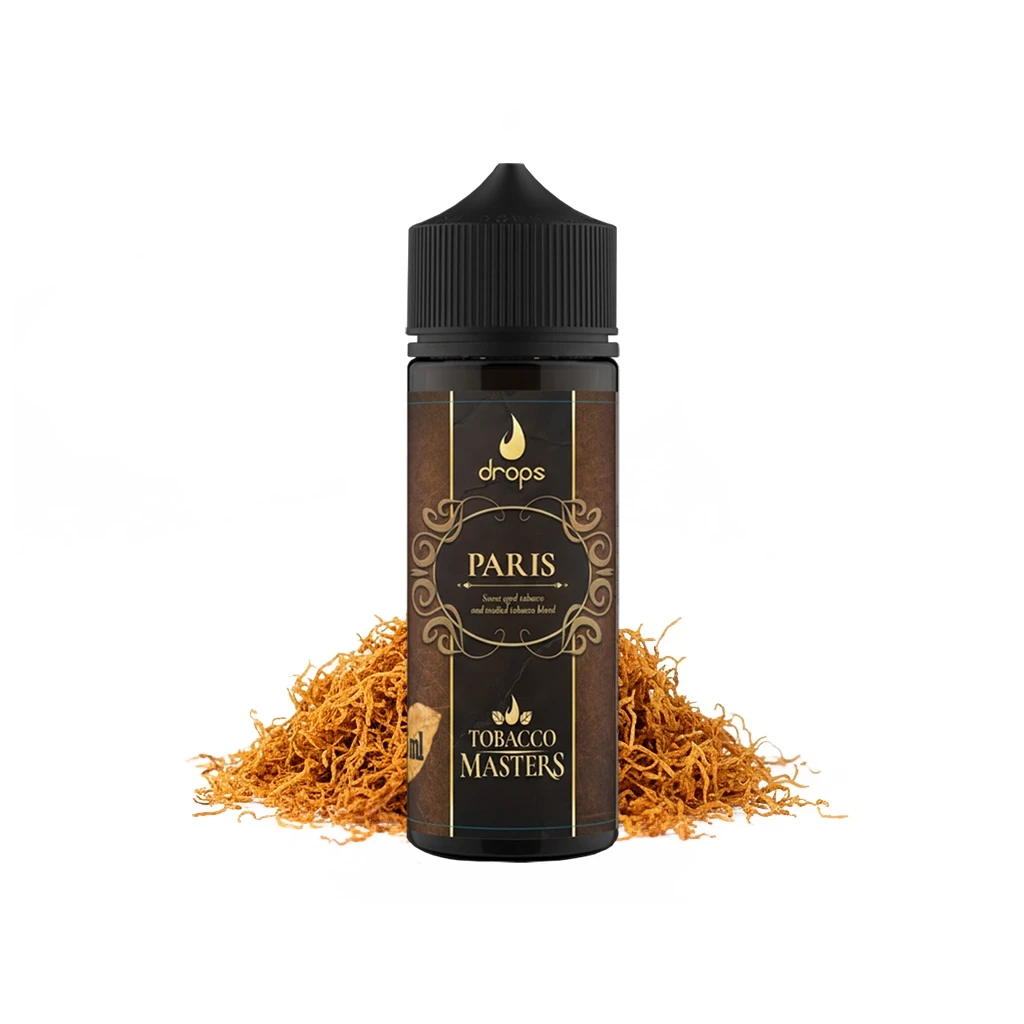 Frasco oscuro de Drops Tobacco Masters Paris con tapón negro y etiqueta marrón con adornos dorados, ante un montón de hebras de tabaco.