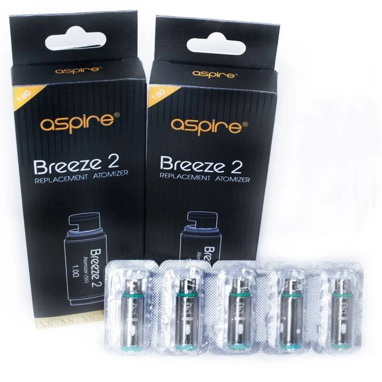 Resistencias Aspire Breeze 2 metálicas con juntas verdes en blísteres, delante de cajas negras con la indicación 1,0 Ω.