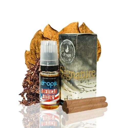 Frasco Drops American Luxury junto a su caja Signature, con hojas de tabaco al fondo y cigarros marrones en primer plano.