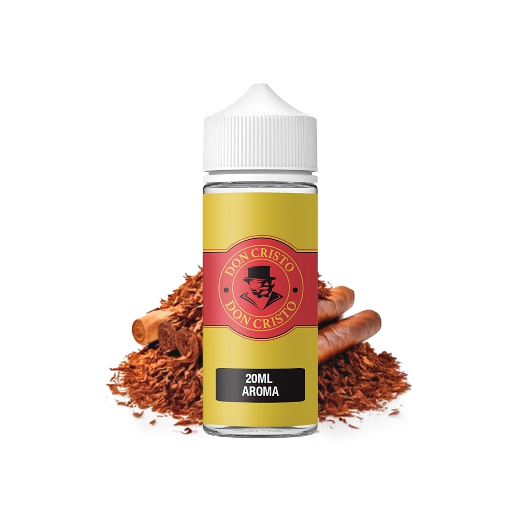 Frasco Don Cristo Original con tapón blanco y etiqueta amarilla y roja que indica 20 ml de aroma, delante de puros y tabaco picado.