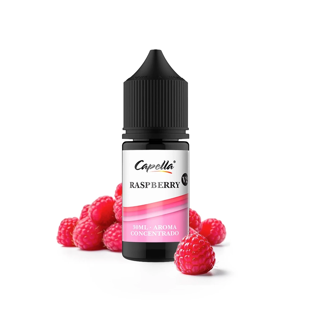 Frasco de Capella Raspberry V2 con tapón negro y etiqueta blanca y rosa de 30 ml, rodeado de frambuesas sobre fondo blanco.