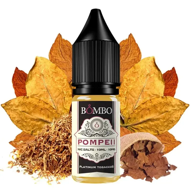 Frasco Bombo Pompeii Platinum Tobaccos con tapón negro y etiqueta de 10 ml y 10 mg, rodeado de hojas y tabaco desmenuzado.