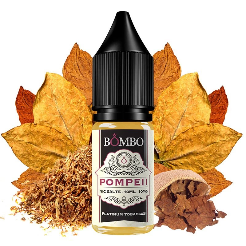 Frasco Bombo Pompeii Platinum Tobaccos con tapón negro y etiqueta de 10 ml y 10 mg, rodeado de hojas y tabaco desmenuzado.