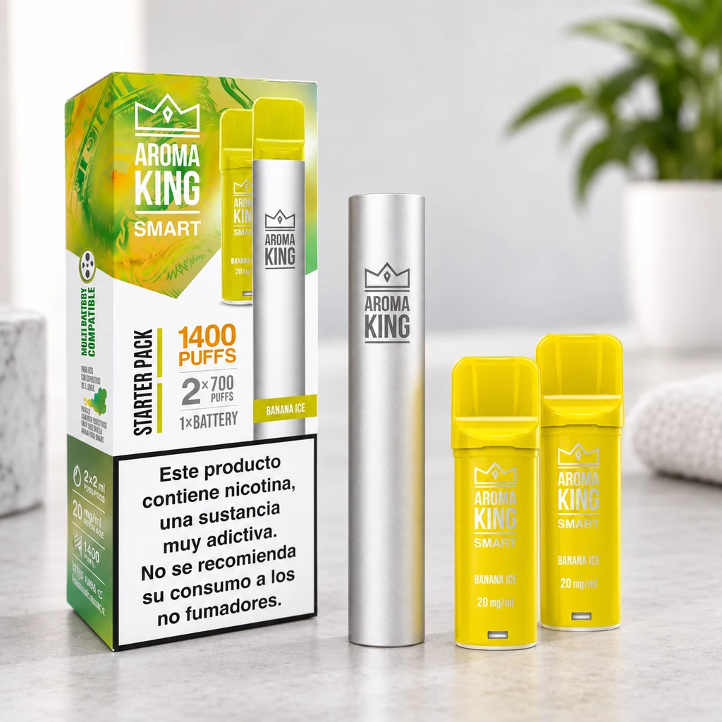 Kit Aroma King Smart Banana Ice con caja, dispositivo plateado y recambios amarillos sobre una encimera, con una planta al fondo.