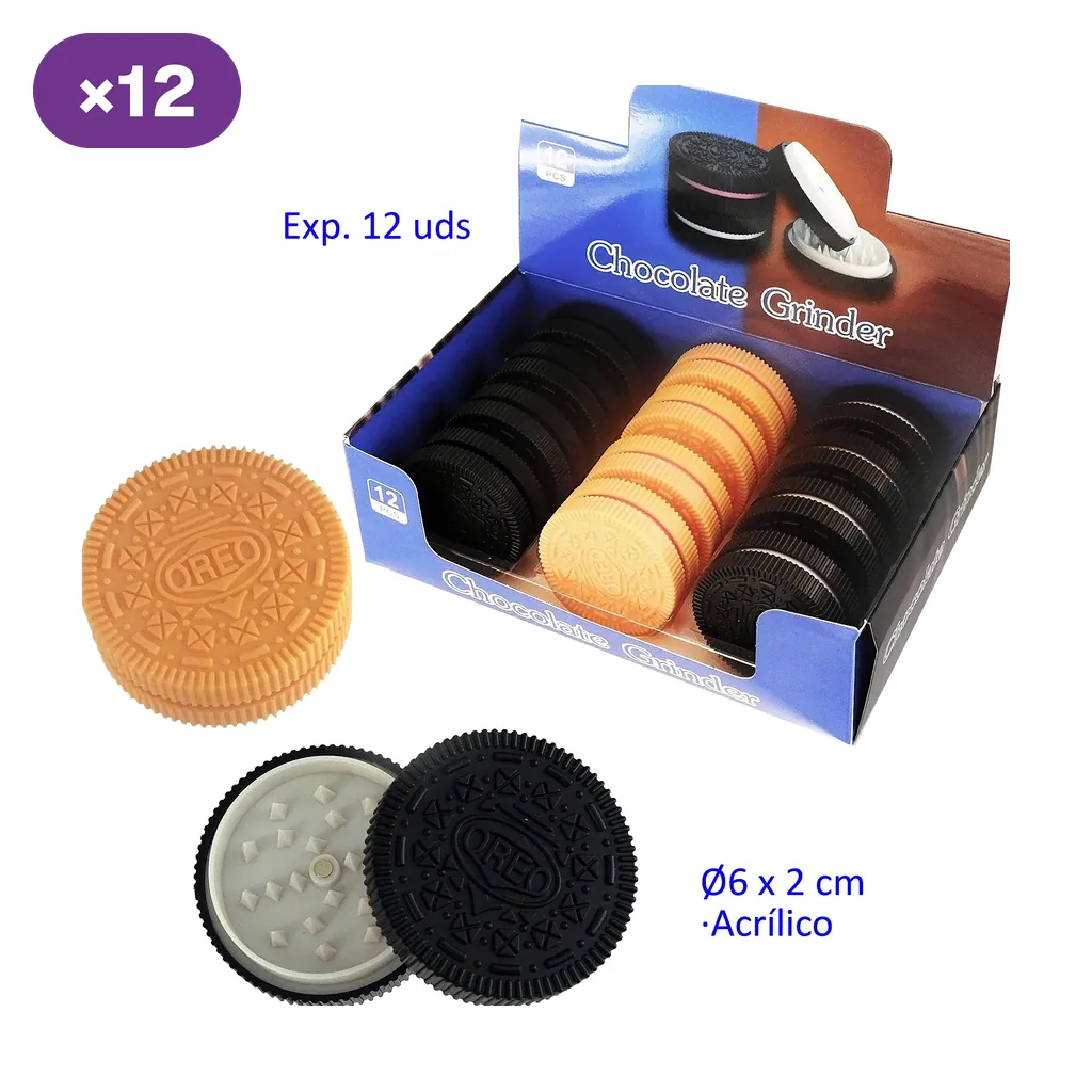 Grinders con forma de galleta en tonos negro y dorado, en expositor y abiertos para mostrar los dientes blancos del interior.