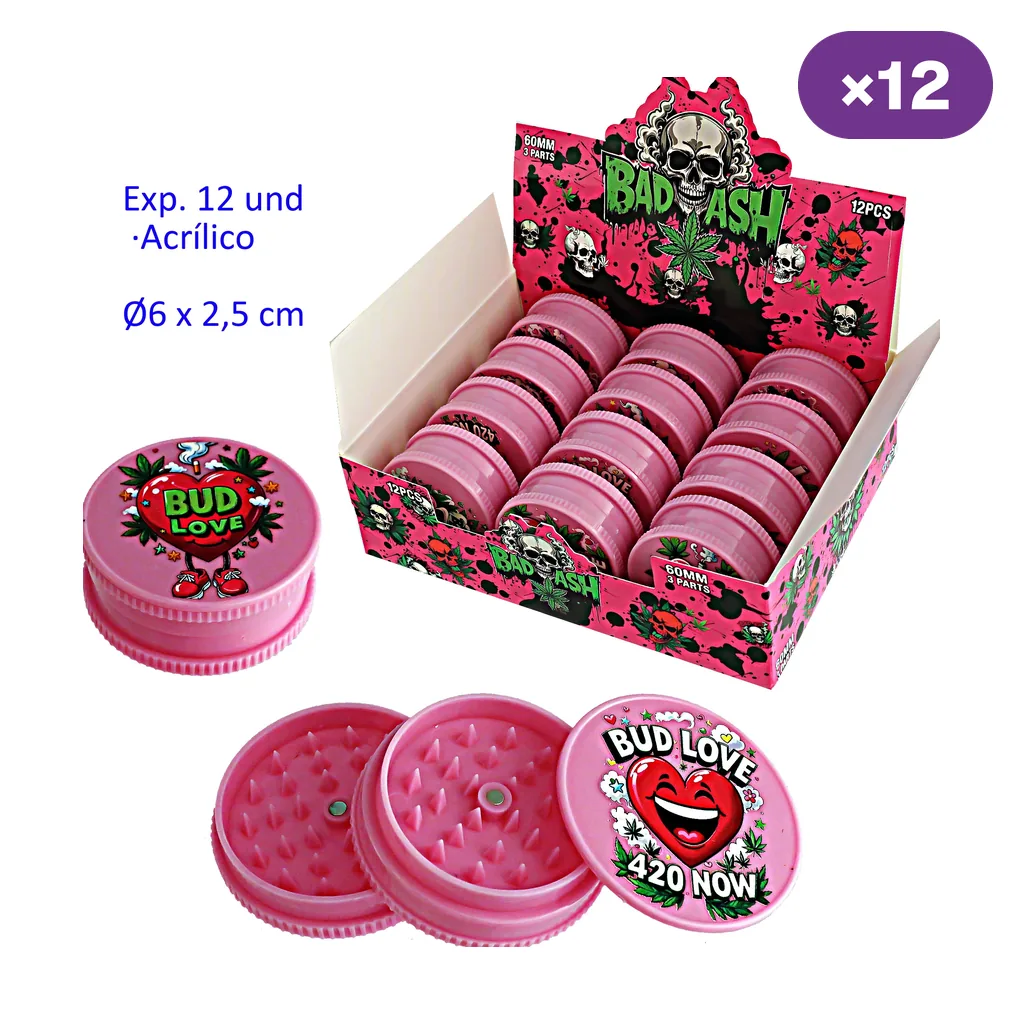 Expositor de grinders rosas con dibujos variados y vistas de un modelo cerrado y otro desmontado, con los dientes interiores visibles.