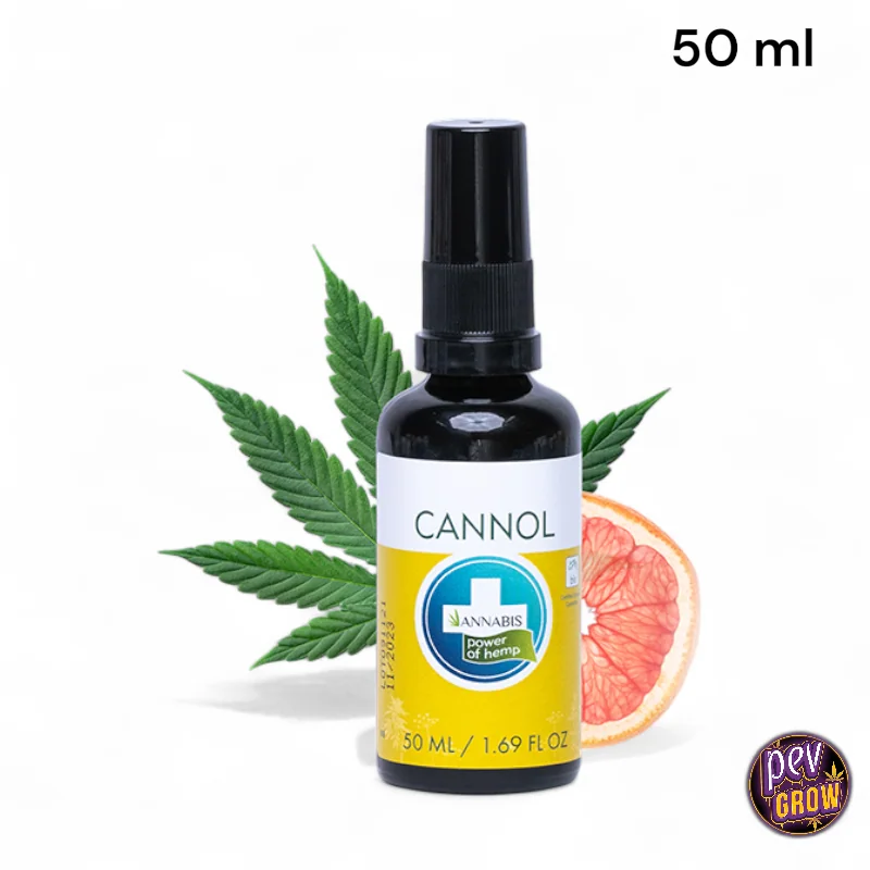 Frasco oscuro de CANNOL con dosificador y etiqueta amarilla y blanca, delante de hojas de cáñamo y una rodaja de cítrico rosado.