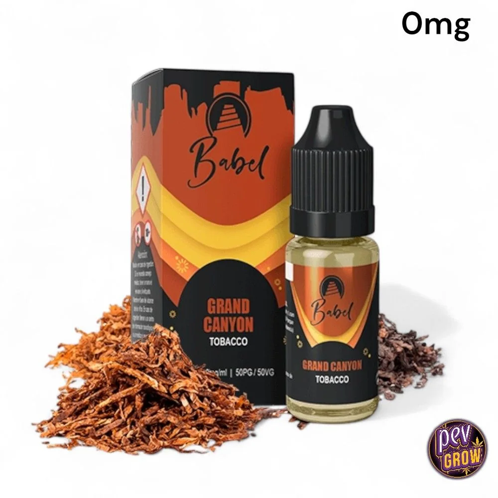 Frasco de Babel Grand Canyon Tobacco con tapón negro y caja naranja y negra, rodeados de tabaco sobre fondo blanco; texto 0 mg.