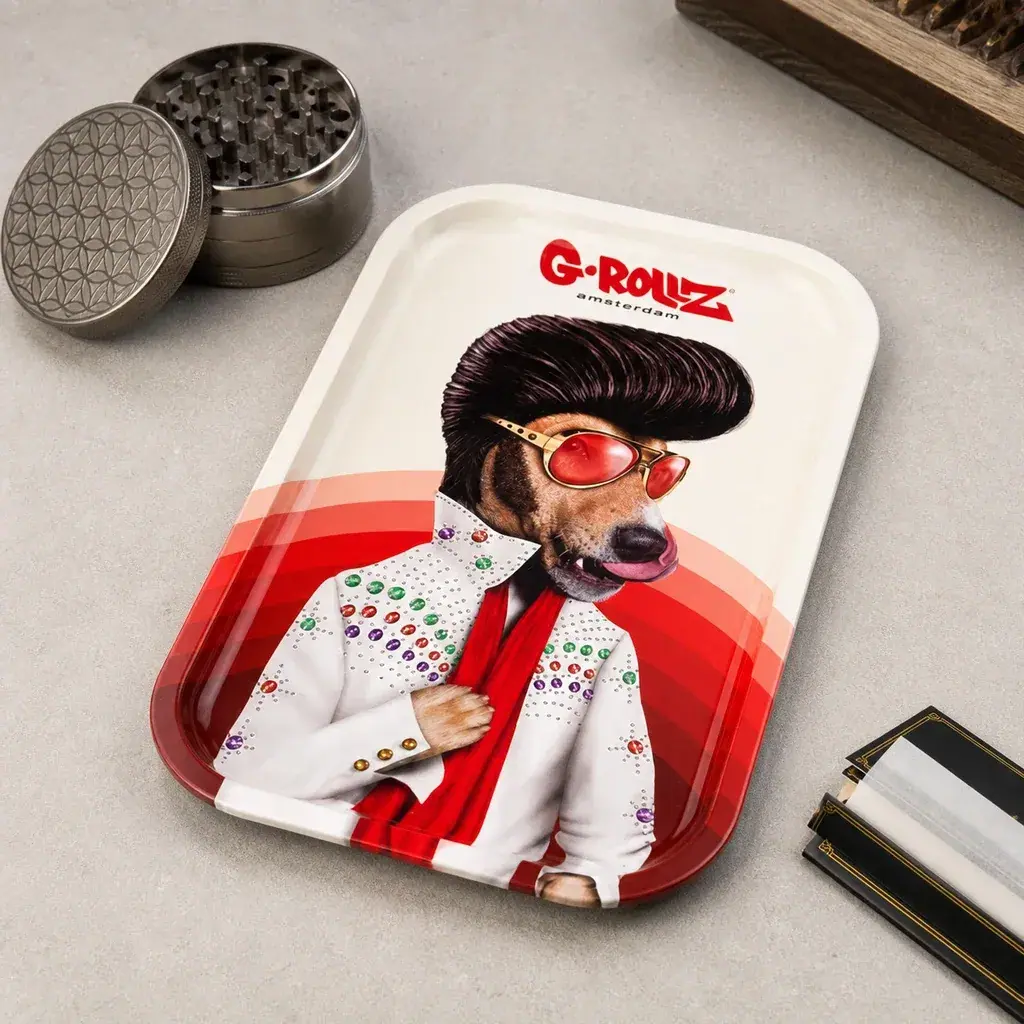 Bandeja G-Rollz Vegas con un perro con tupé, gafas rojas y traje blanco decorado, junto a un grinder abierto y papel de liar.