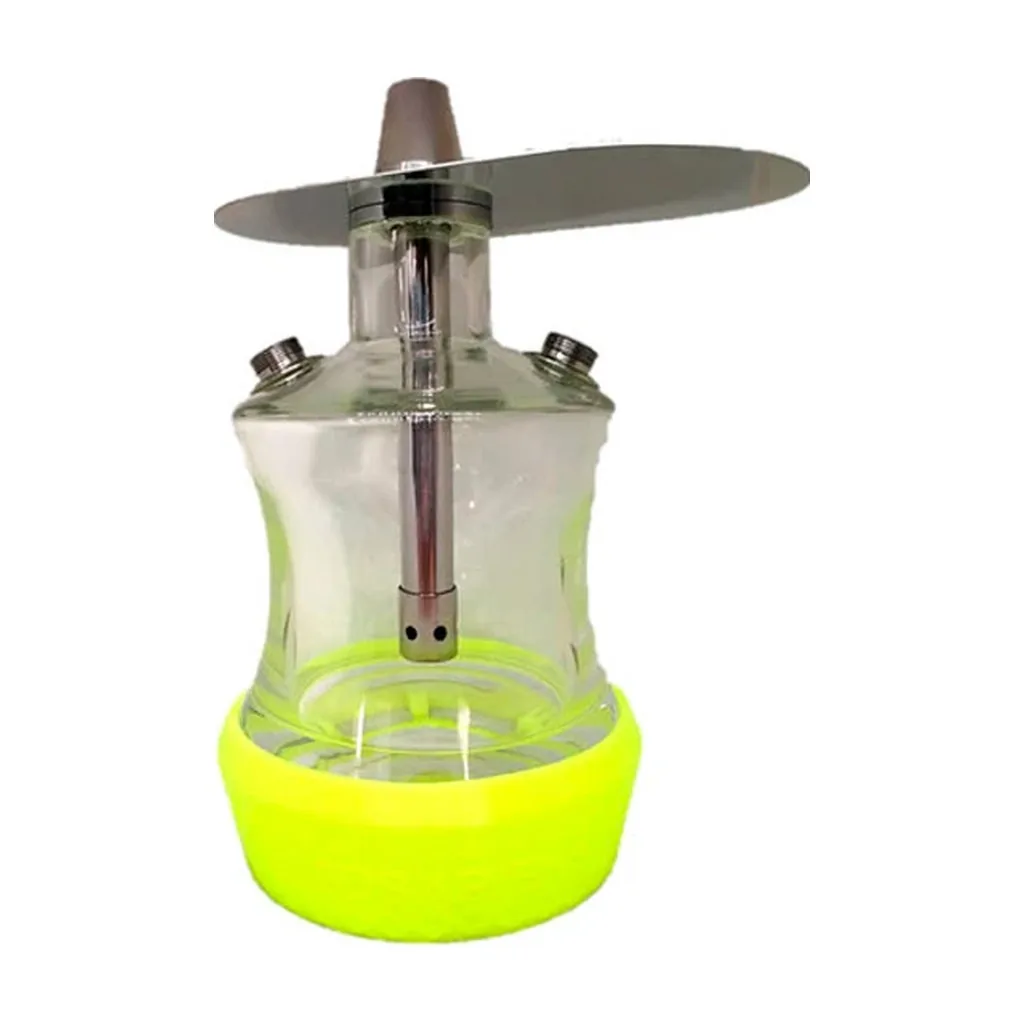 Base amarilla para LED Oduman Travel colocada bajo una cachimba transparente con tubo central y bandeja metálica, sobre fondo blanco. Base amarilla para LED Oduman Travel colocada bajo una cachimba transparente con tubo central y bandeja metálica, sobre fondo blanco.