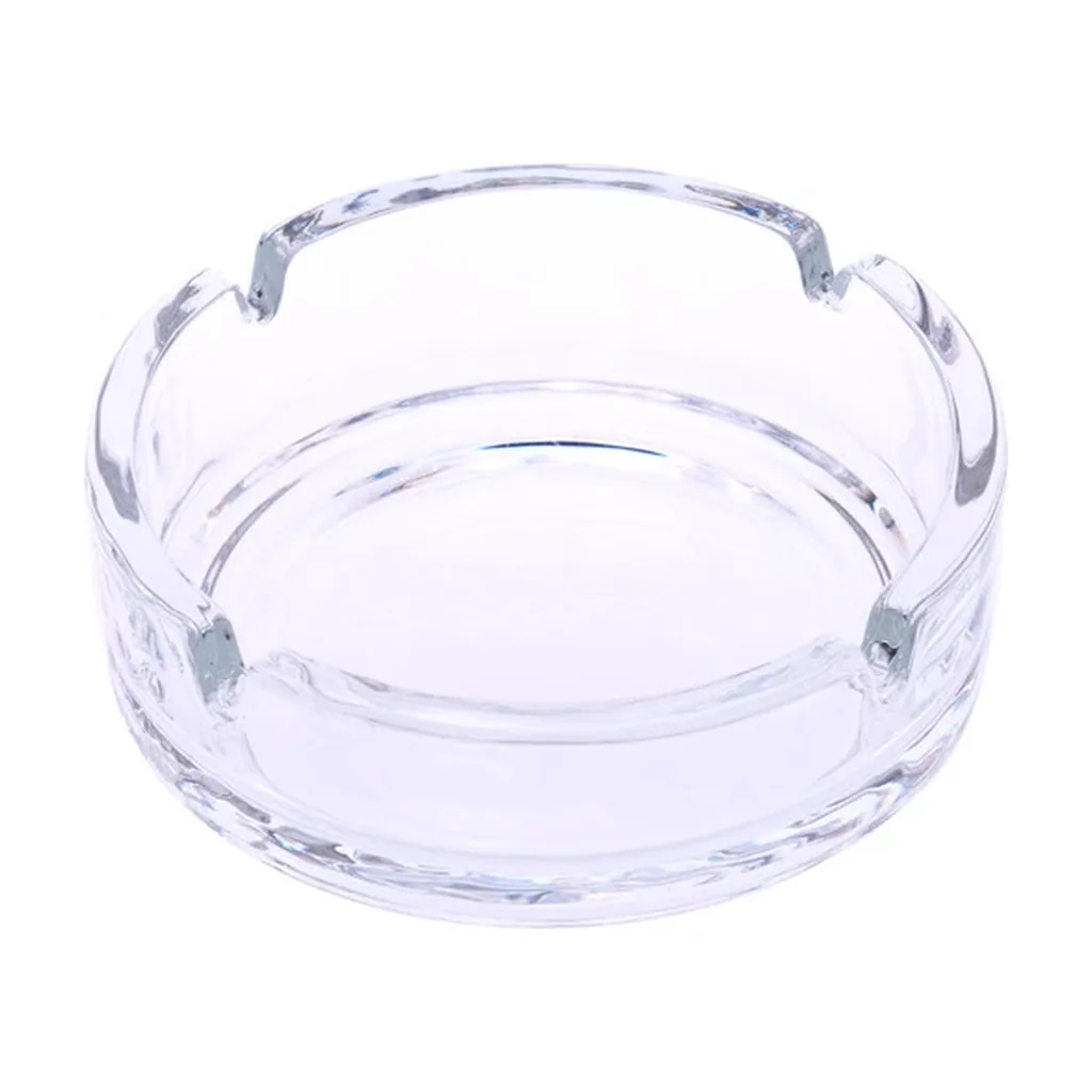 Cenicero redondo de cristal transparente Champ High, visto desde arriba en perspectiva, con cuatro muescas en el borde.