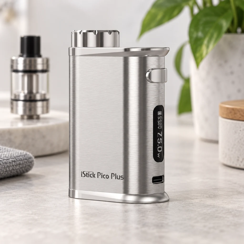 Mod Eleaf iStick Pico Plus plateado, con pantalla que indica 75,0 W y puerto frontal; un atomizador aparece separado al fondo.