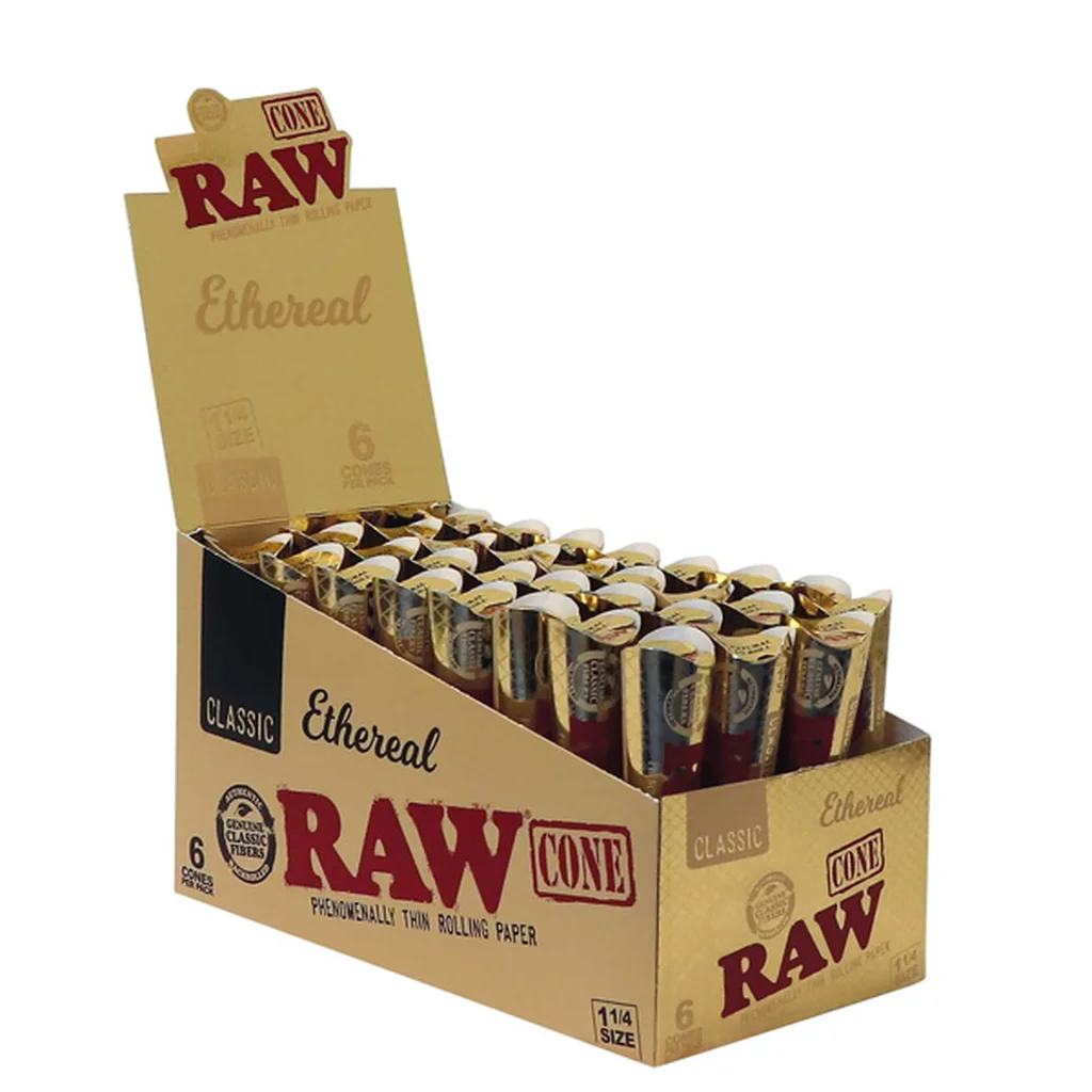 Expositor dorado abierto de conos RAW Ethereal 1¼, con varias unidades en envases individuales y logotipos rojos sobre fondo blanco.