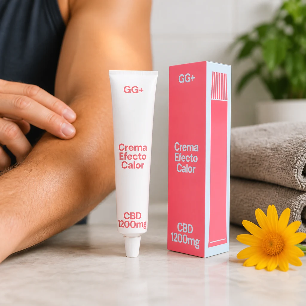 Tubo y caja rosa de crema efecto calor CBD GG+, junto a una persona que toca su antebrazo, toallas y una flor amarilla.