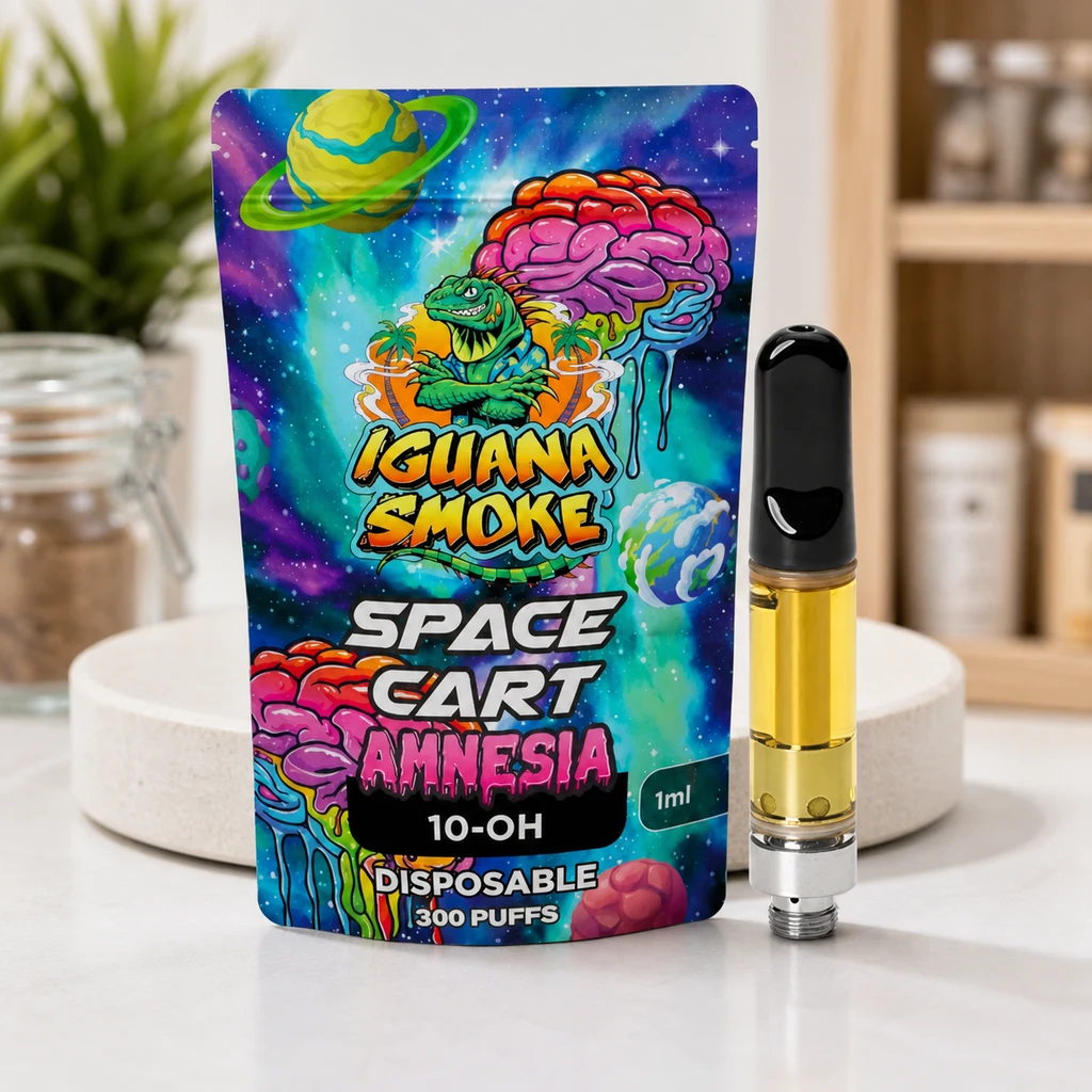 Cartucho Amnesia 10-OH con boquilla negra y depósito amarillo junto a un envase Space Cart de diseño espacial multicolor.
