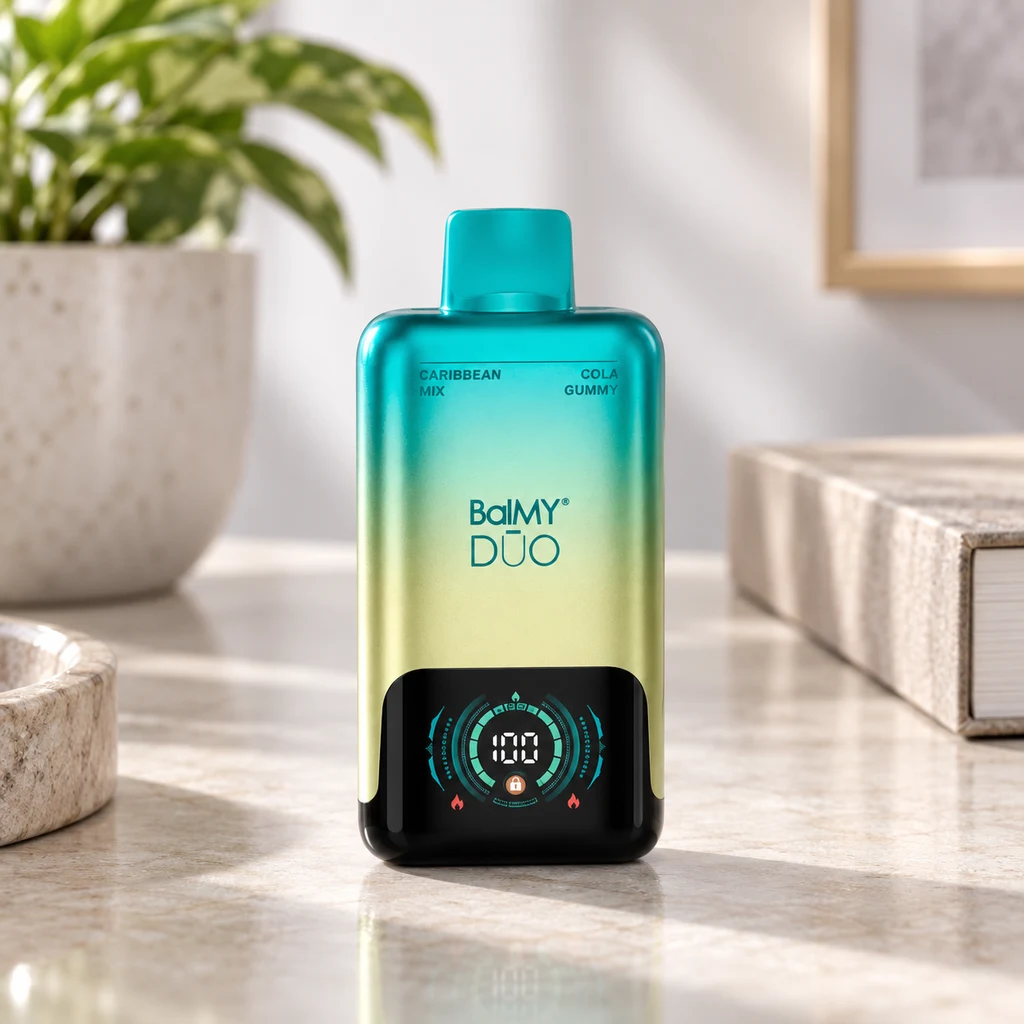 Balmy DŪO Caribbean Mix Cola Gummy con cuerpo turquesa y amarillo, boquilla superior y pantalla que muestra 100, sobre una encimera.