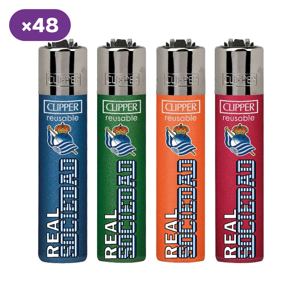 Cuatro diseños de encendedores Clipper de la Real Sociedad en azul, verde, naranja y rojo, con escudo del club y distintivo ×48.