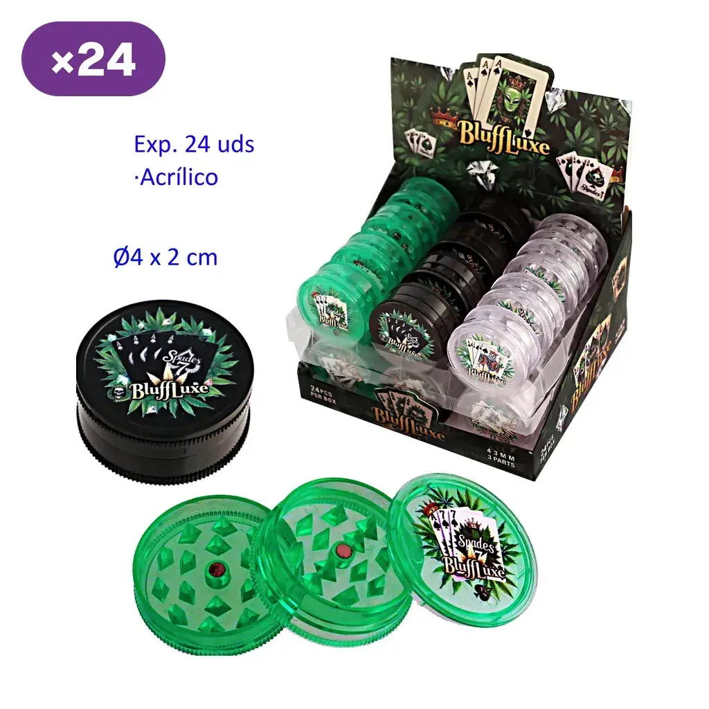 Expositor BluffLuxe con grinders verdes, negros y transparentes; delante aparecen uno negro cerrado y uno verde abierto con dientes.
