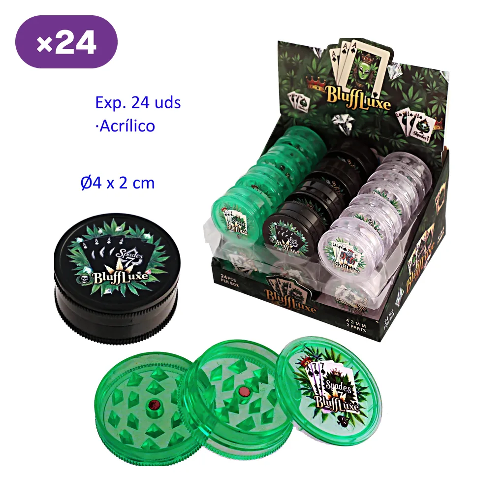 Expositor BluffLuxe con grinders verdes, negros y transparentes; delante aparecen uno negro cerrado y uno verde abierto con dientes.