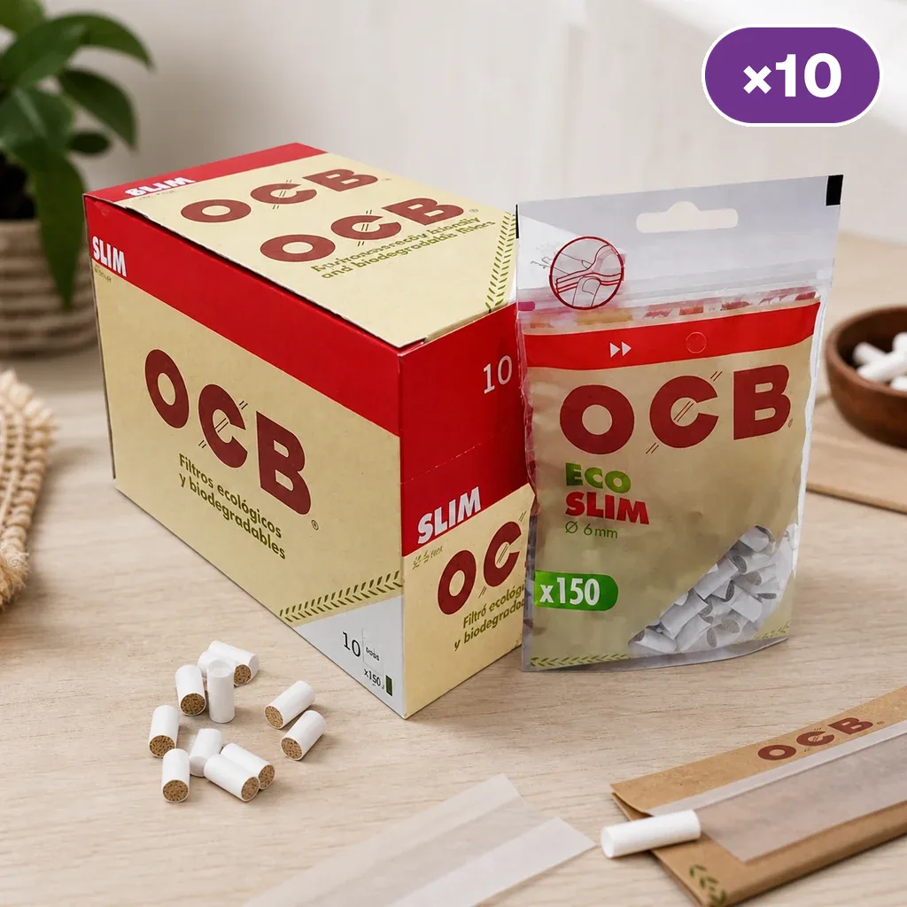 Caja y bolsa OCB Eco Slim con las indicaciones 6 mm y 150, junto a filtros sueltos y papel de liar sobre una mesa.