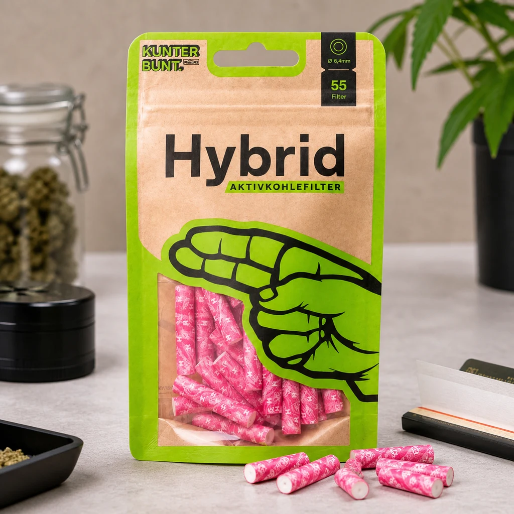 Bolsa Hybrid con ventana que muestra filtros magenta y varias unidades sobre la mesa, junto a un grinder y papel de liar.