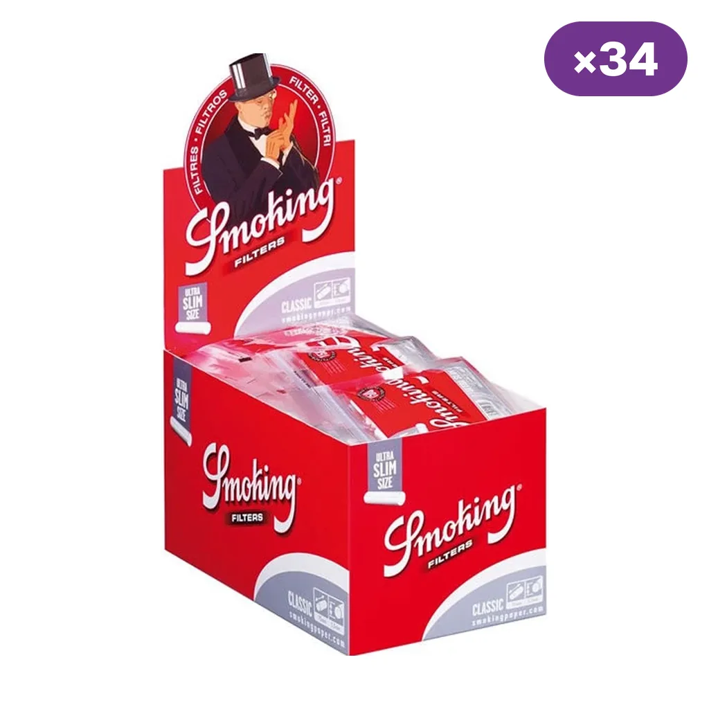Caja expositora roja de filtros Smoking Ultra Slim con varias bolsas en su interior y un distintivo morado que indica 34 unidades.