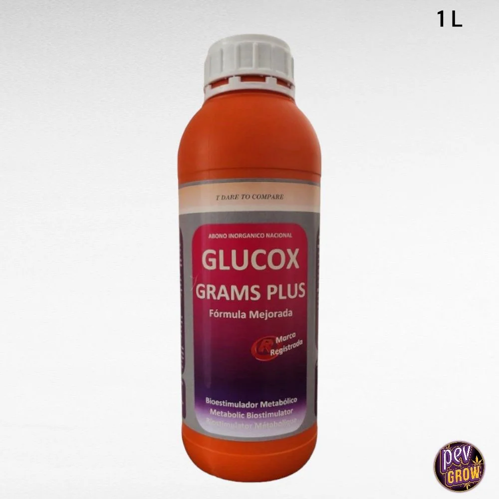 Botella naranja de Glucox Grams Plus con tapón blanco y etiqueta en tonos magenta; indicación de 1 L en la esquina superior derecha.