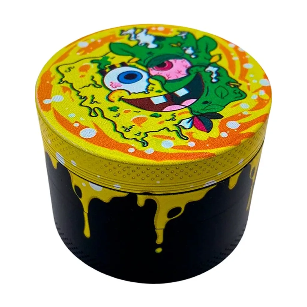Grinder Bob cerrado, con cuerpo negro, motivos de goteo amarillo y un personaje de ojos grandes en la tapa amarilla y naranja.