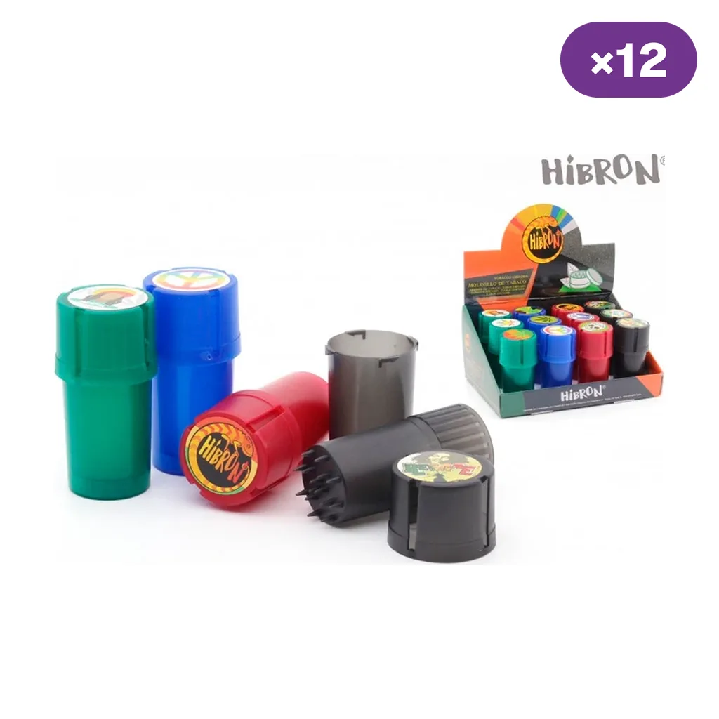 Grinders Hibron con bote en varios colores, uno desmontado con dientes visibles, junto a un expositor y el distintivo ×12.