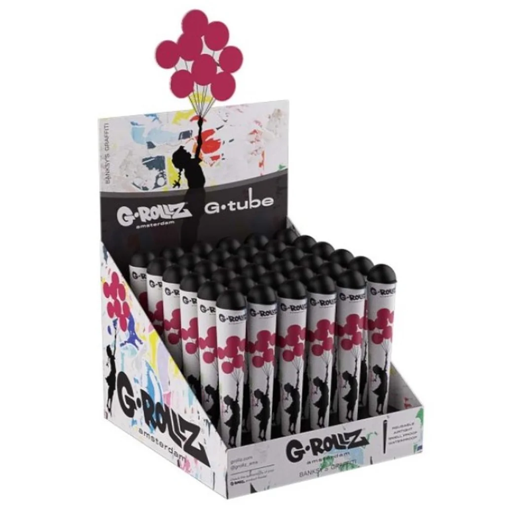 Expositor de portaporros G-Rollz con tapas negras y dibujos de una niña con globos rosas, sobre fondo blanco.