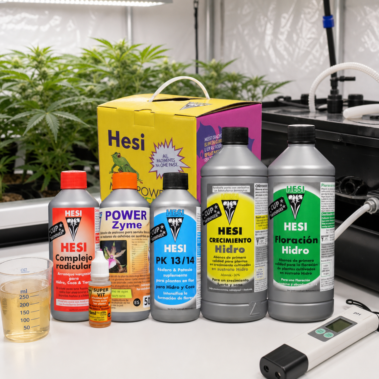 Envases Hesi Starterbox Hydro ante su caja amarilla y rosa, con vaso graduado y medidor digital junto a un cultivo interior.