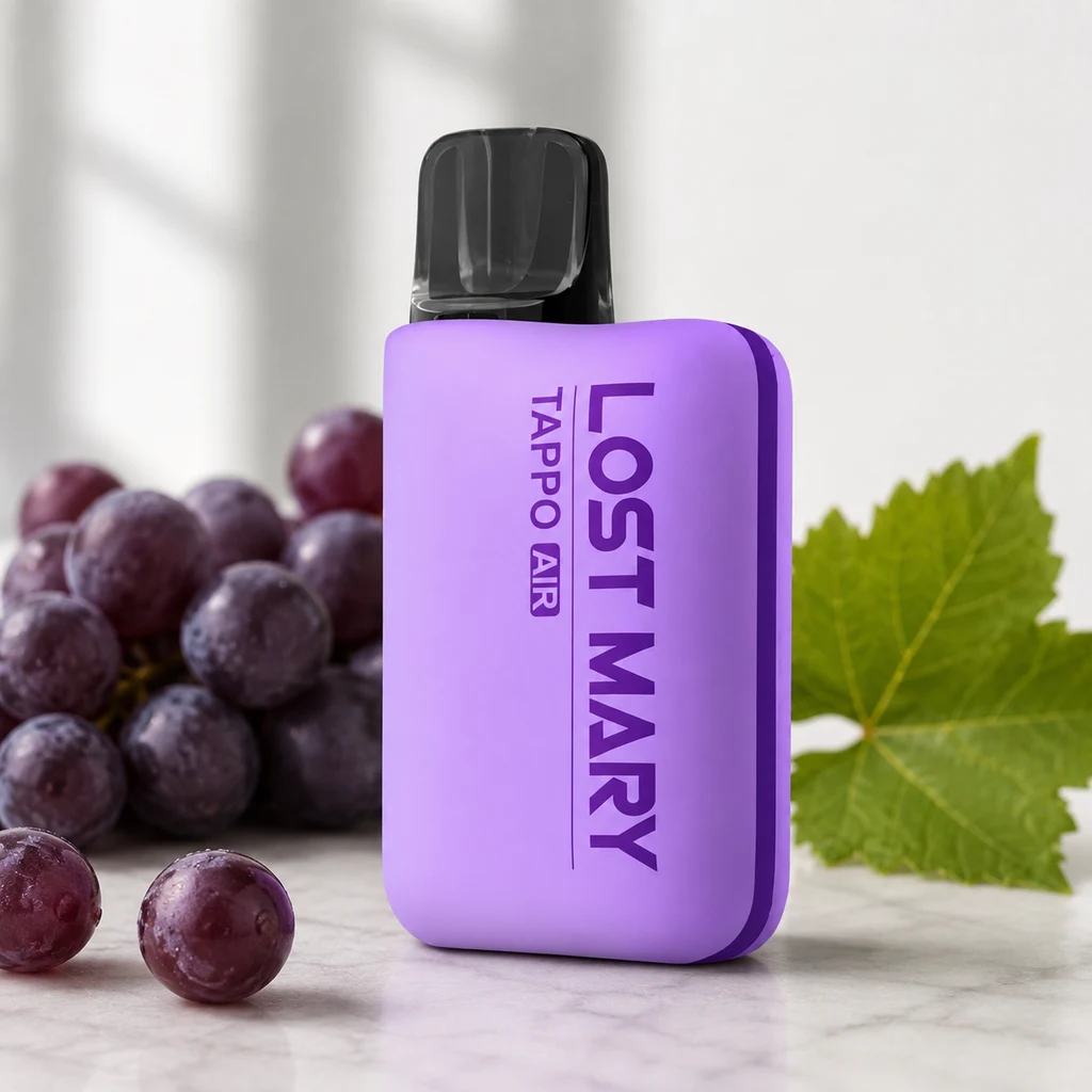 Dispositivo morado Lost Mary con inscripción Tappo Air y boquilla negra, junto a uvas oscuras y una hoja verde.