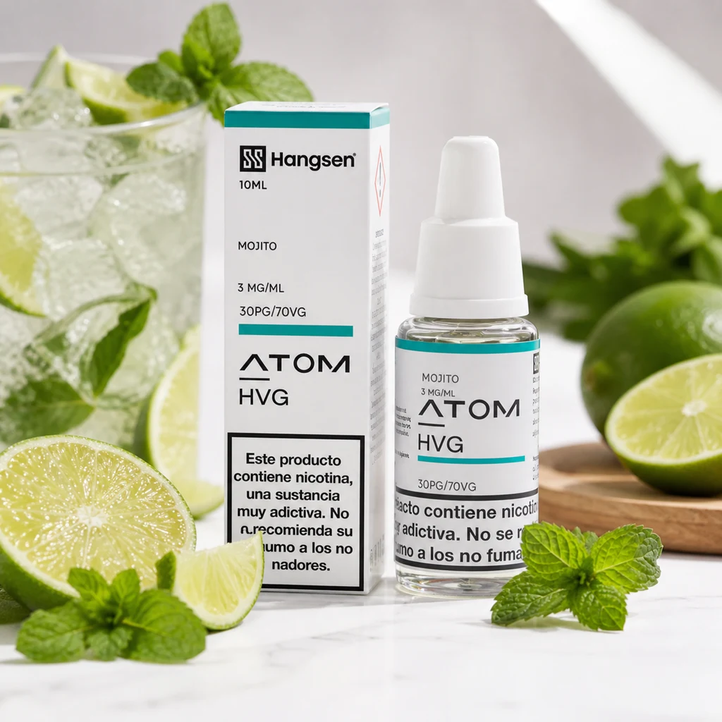 Frasco y caja Hangsen Atom HVG Mojito, con etiquetas de 3 mg/ml y 30PG/70VG, junto a limas, menta y un vaso con hielo.