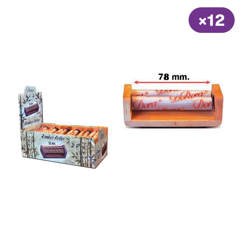 Máquina de liar Dora de bambú con medida indicada de 78 mm, junto a una caja expositora y el distintivo de 12 unidades. Máquina de liar Dora de bambú con medida indicada de 78 mm, junto a una caja expositora y el distintivo de 12 unidades.