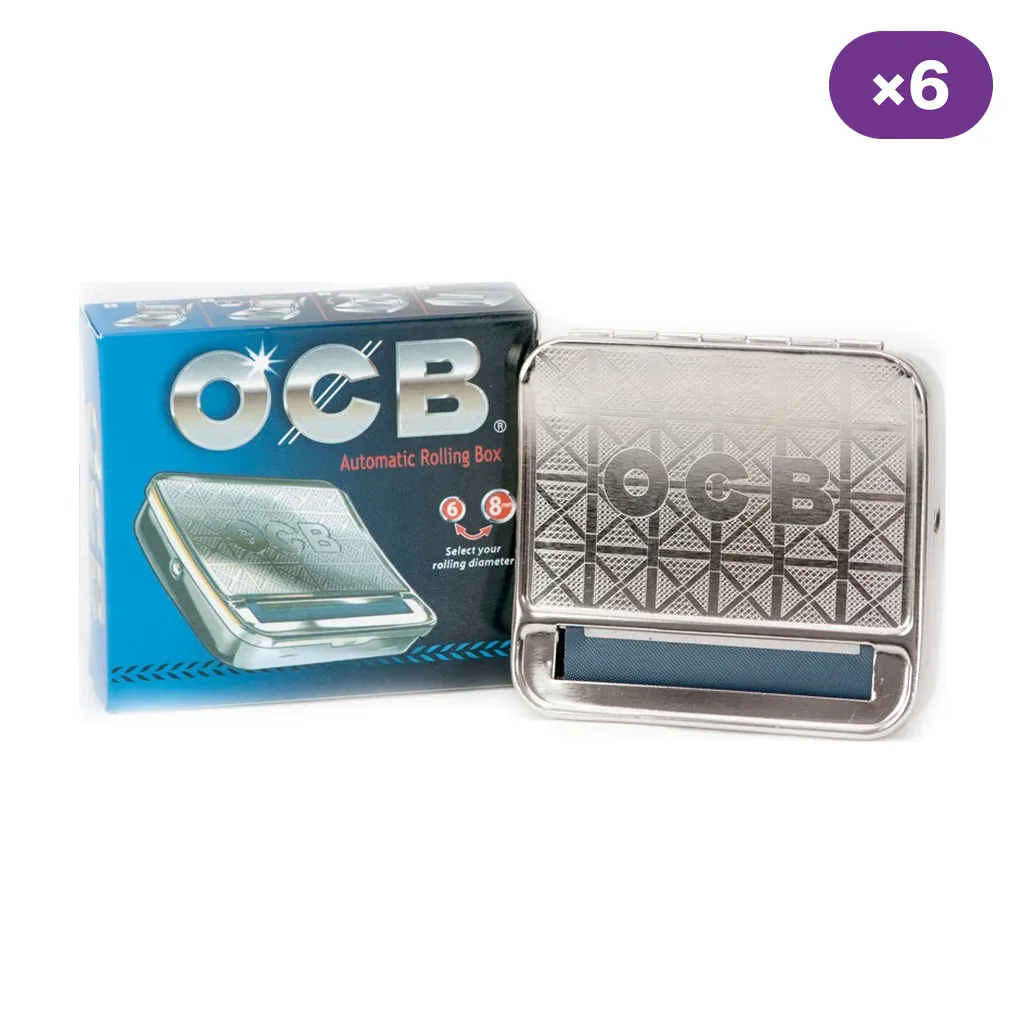 Máquina de liar automática OCB plateada con dibujo geométrico, junto a su caja azul y negra y un distintivo «×6». Máquina de liar automática OCB plateada con dibujo geométrico, junto a su caja azul y negra y un distintivo «×6».