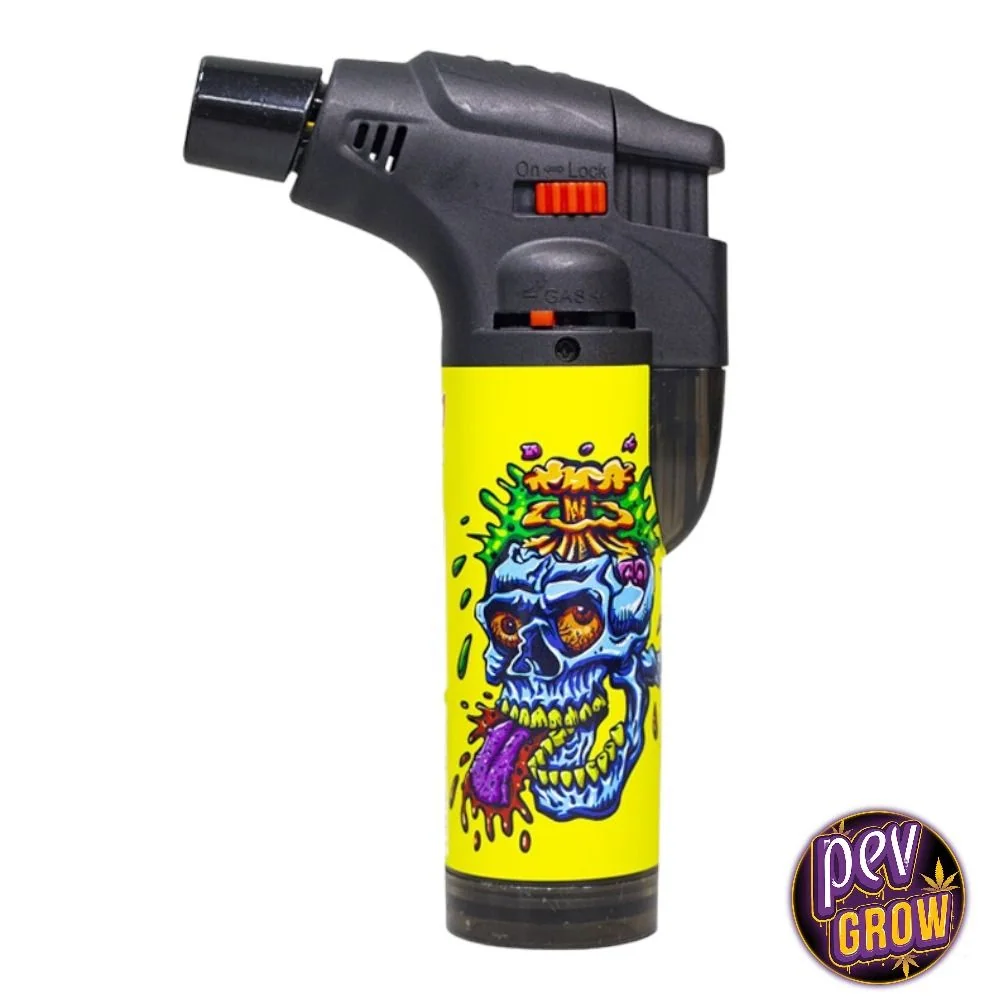 Encendedor turbo Prof Surf Crazy Skulls con cabezal negro, controles rojos y cuerpo amarillo decorado con una calavera azul.