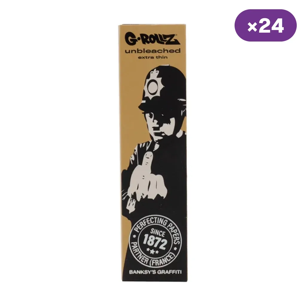 Envase de papel G-Rollz con diseño de un policía que levanta el dedo corazón, fondo dorado y distintivo «×24» en la esquina superior. Envase de papel G-Rollz con diseño de un policía que levanta el dedo corazón, fondo dorado y distintivo «×24» en la esquina superior.