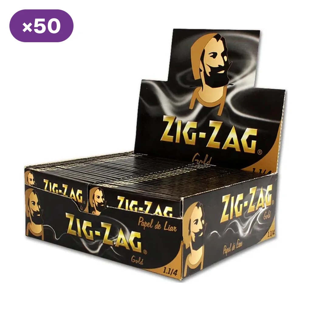 Caja expositora abierta de papel de fumar Zig-Zag Gold 1 1/4, con numerosos libritos negros y dorados y distintivo de 50 unidades.