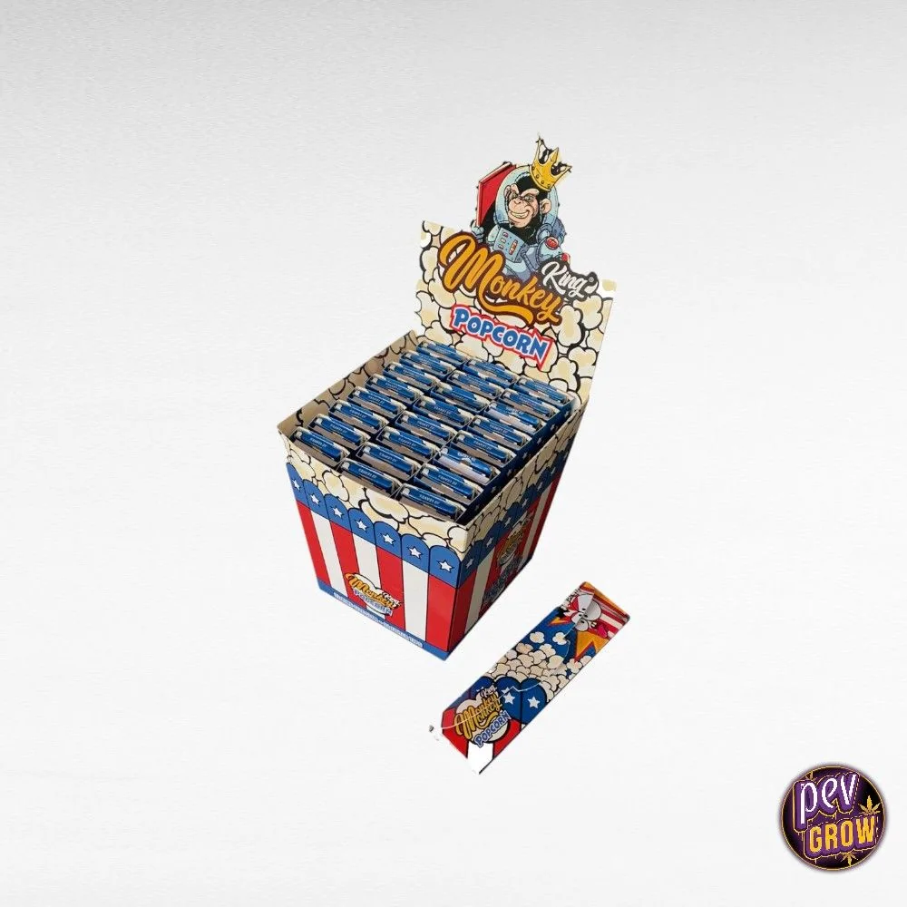 Expositor de papel de liar Monkey King Pop Corn con varios libritos y uno delante, decorados con palomitas y franjas rojas y blancas.